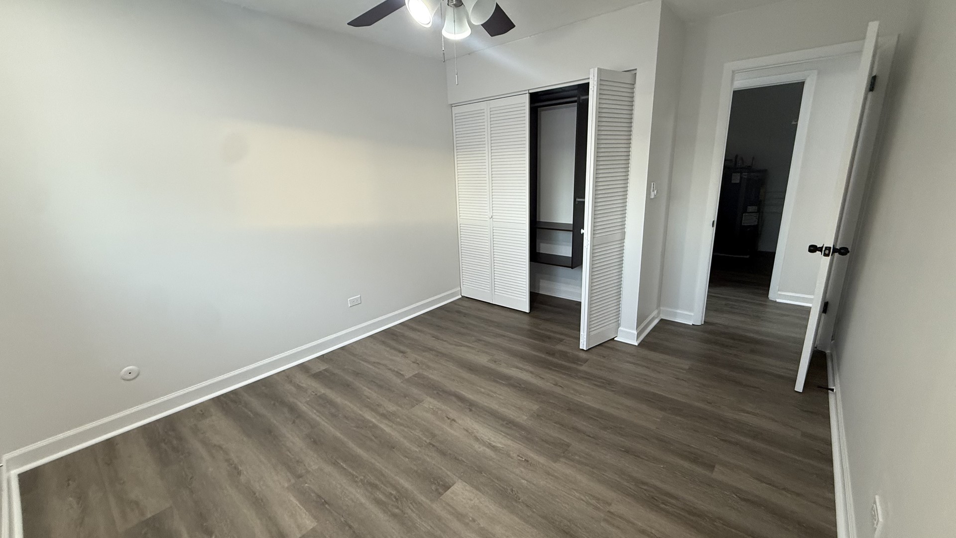 880 East Old Willow Road, Unit 175 Prospect Heights, IL 60070 - Photo 7 of 10 an empty room with wooden floor and entrance
