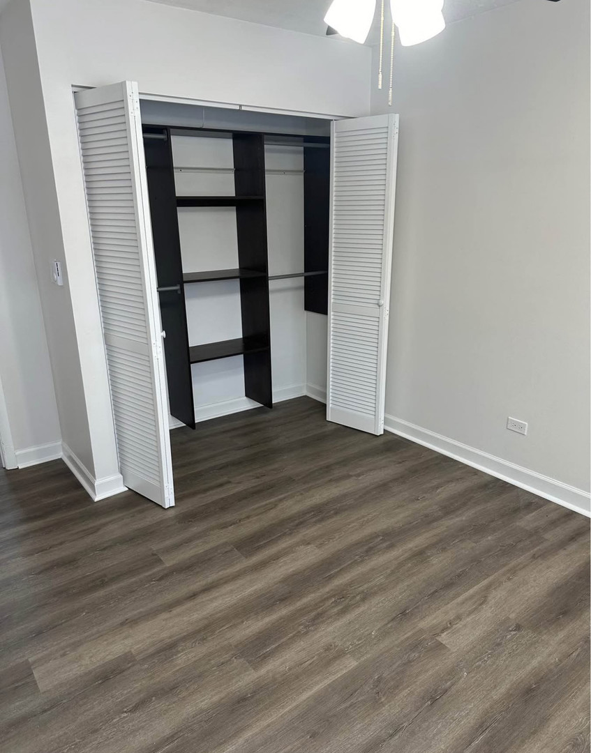 880 East Old Willow Road, Unit 175 Prospect Heights, IL 60070 - Photo 9 of 10 an empty room with wooden floor and window