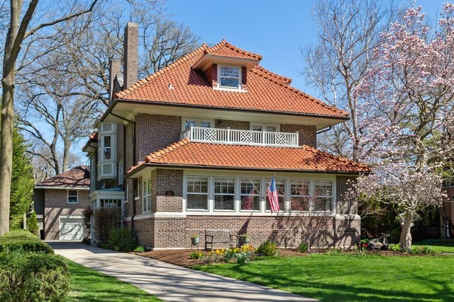 610 Forest Avenue Wilmette, IL 60091 - Photo 1 of 50 a front view of a house with garden