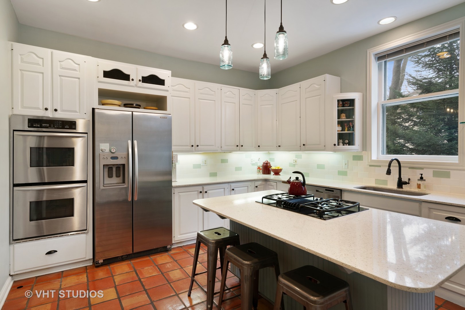 610 Forest Avenue Wilmette, IL 60091 - Photo 11 of 50 a kitchen with stainless steel appliances a stove a sink a microwave and refrigerator