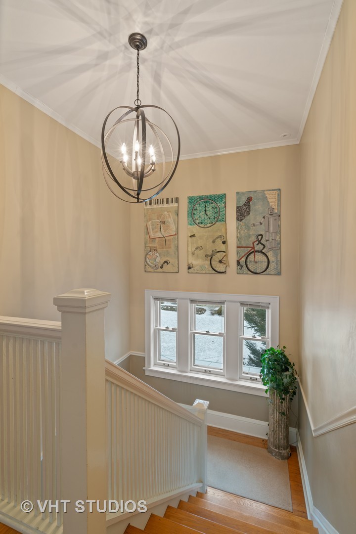 610 Forest Avenue Wilmette, IL 60091 - Photo 16 of 50 a view of a door and a chandelier in a room