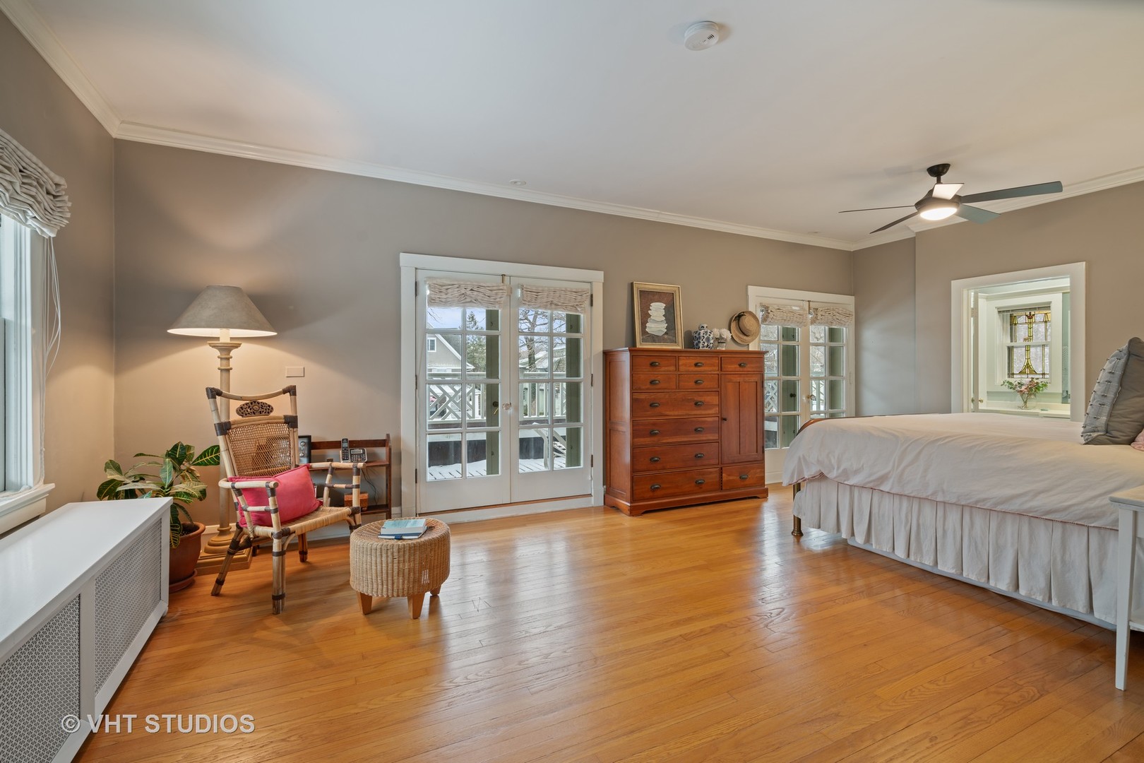 610 Forest Avenue Wilmette, IL 60091 - Photo 17 of 50 a spacious bedroom with a bed a dresser and a large window