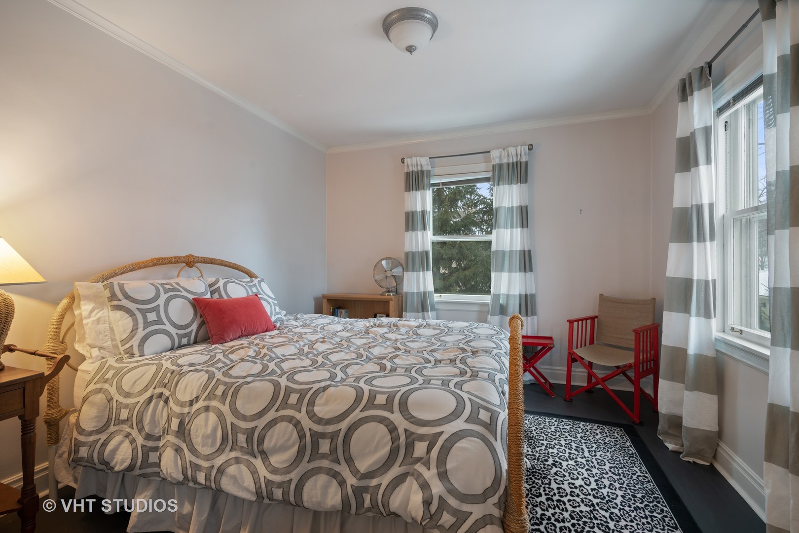 610 Forest Avenue Wilmette, IL 60091 - Photo 19 of 50 a bedroom with a bed and wooden floor