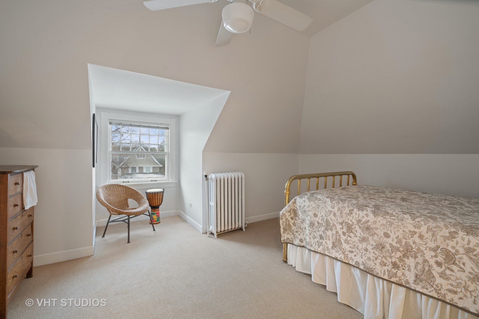 610 Forest Avenue Wilmette, IL 60091 - Photo 23 of 50 a bedroom with a bed and a chair