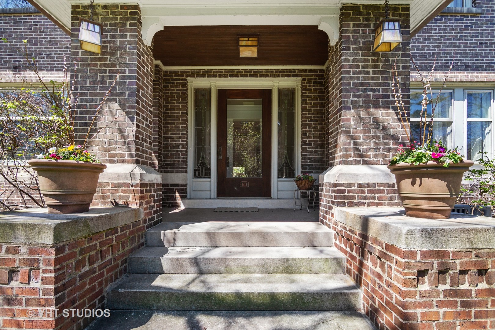 610 Forest Avenue Wilmette, IL 60091 - Photo 4 of 50 a front view of a house with outdoor seating