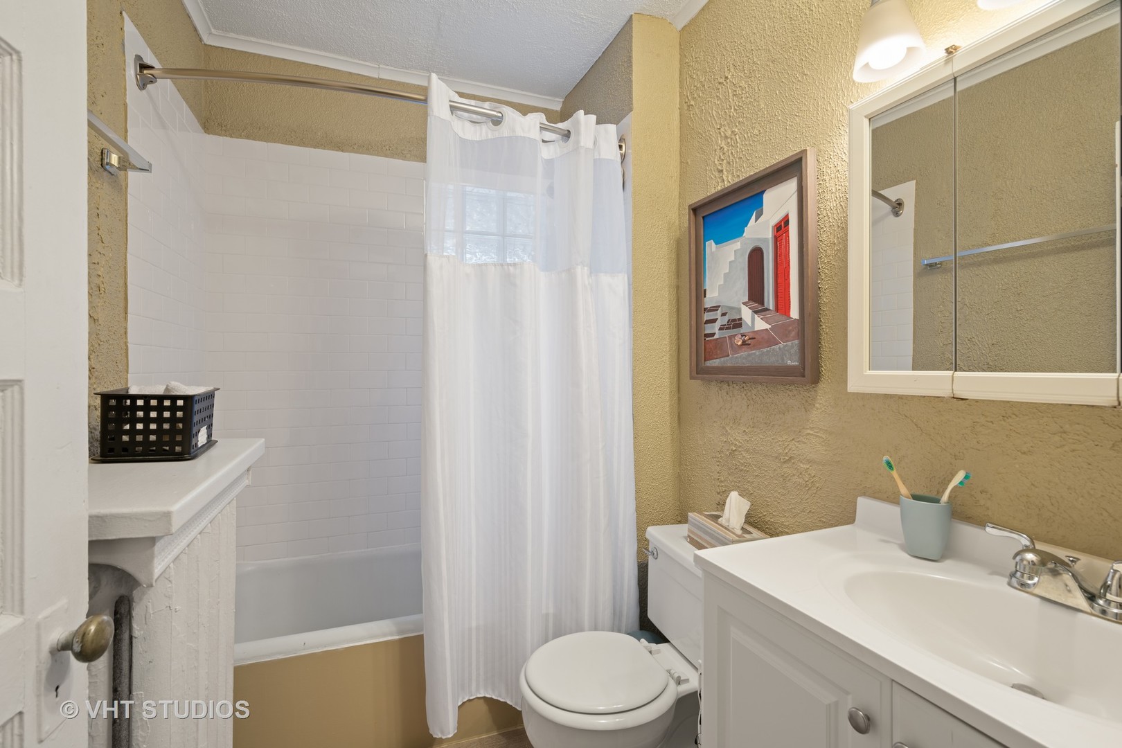 610 Forest Avenue Wilmette, IL 60091 - Photo 33 of 50 a bathroom with a sink a toilet and shower curtain