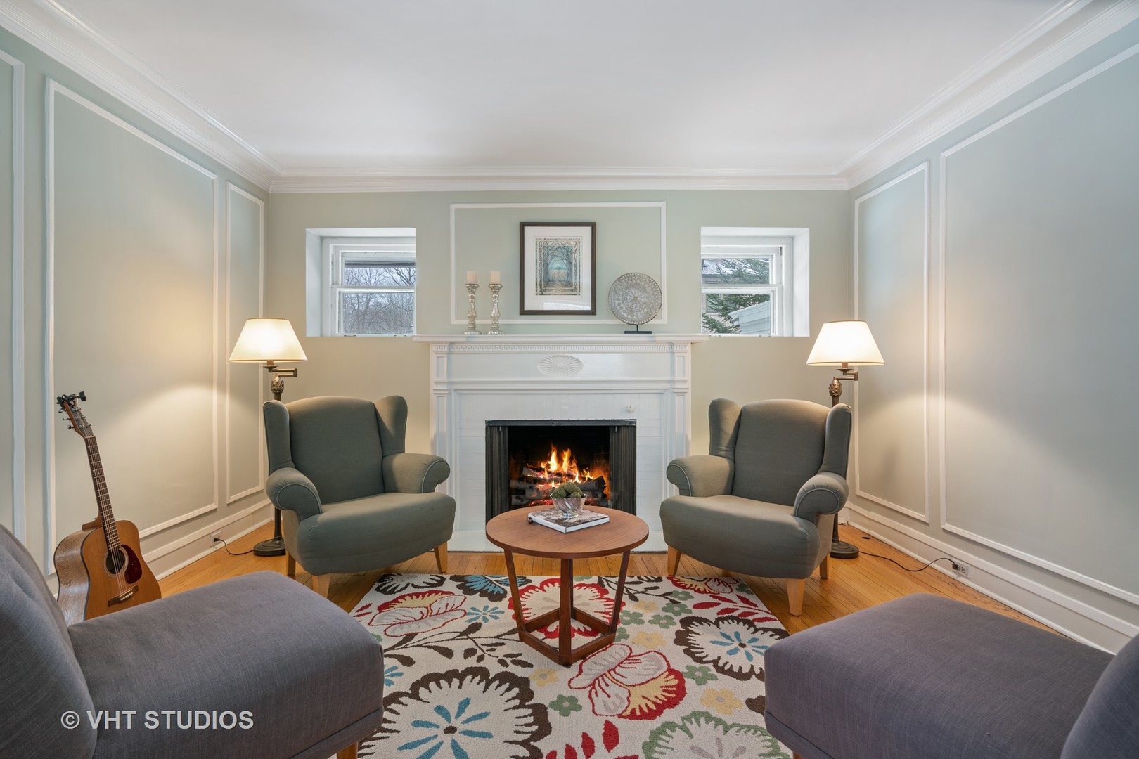 610 Forest Avenue Wilmette, IL 60091 - Photo 5 of 50 a living room with furniture a rug and a fireplace