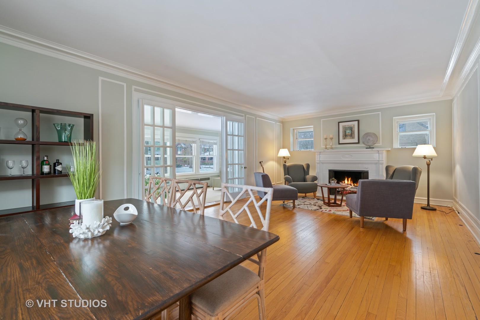 610 Forest Avenue Wilmette, IL 60091 - Photo 6 of 50 a living room with furniture dining table and a fireplace