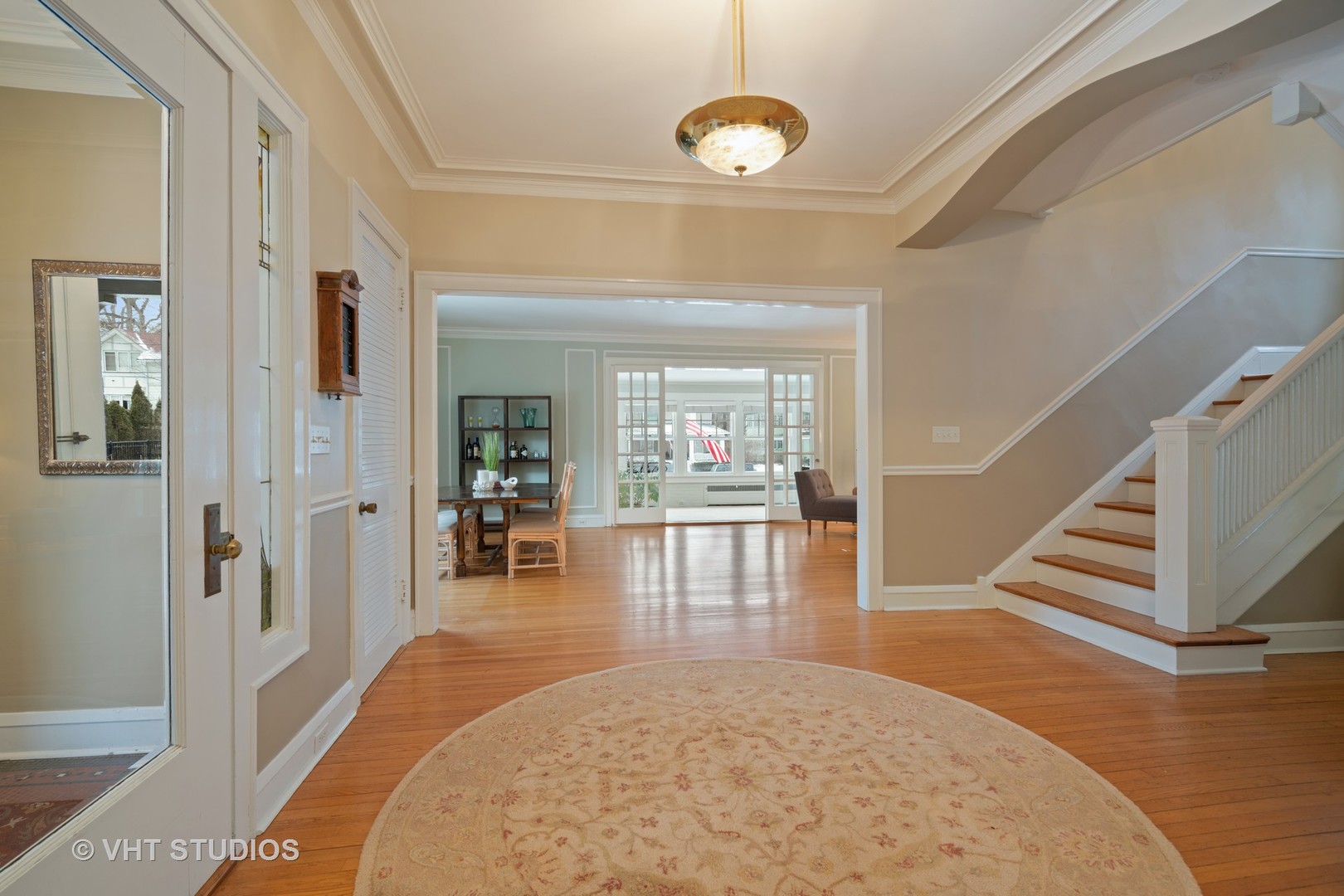 610 Forest Avenue Wilmette, IL 60091 - Photo 9 of 50 a view of a hallway view with wooden floor and staircase