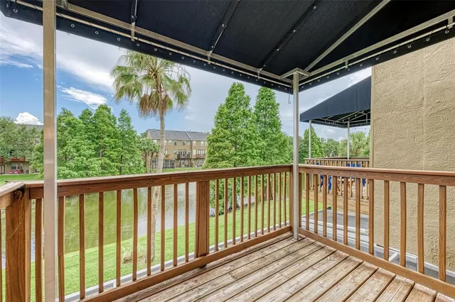 a kitchen with stainless steel appliances granite countertop a refrigerator a stove top oven a sink and dishwasher