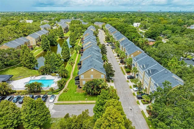 an aerial view of a house with a yard