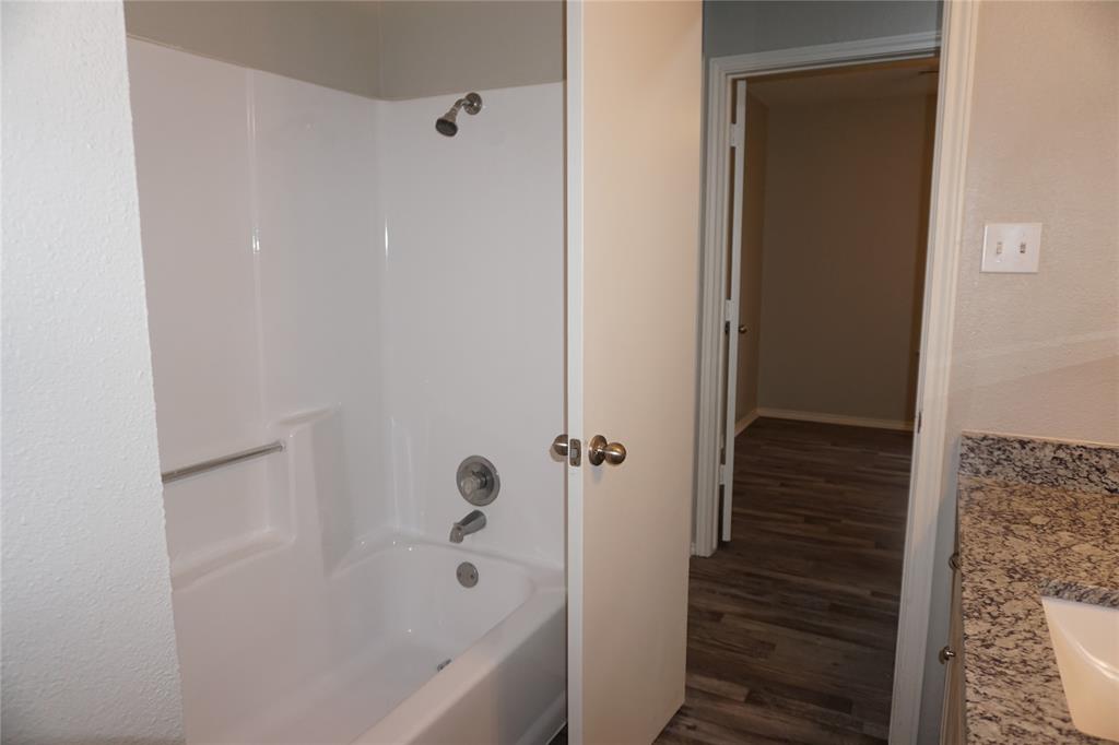 6412 Fairview Drive Watauga, TX 76148 - Photo 12 of 14 a bathroom with a bathtub