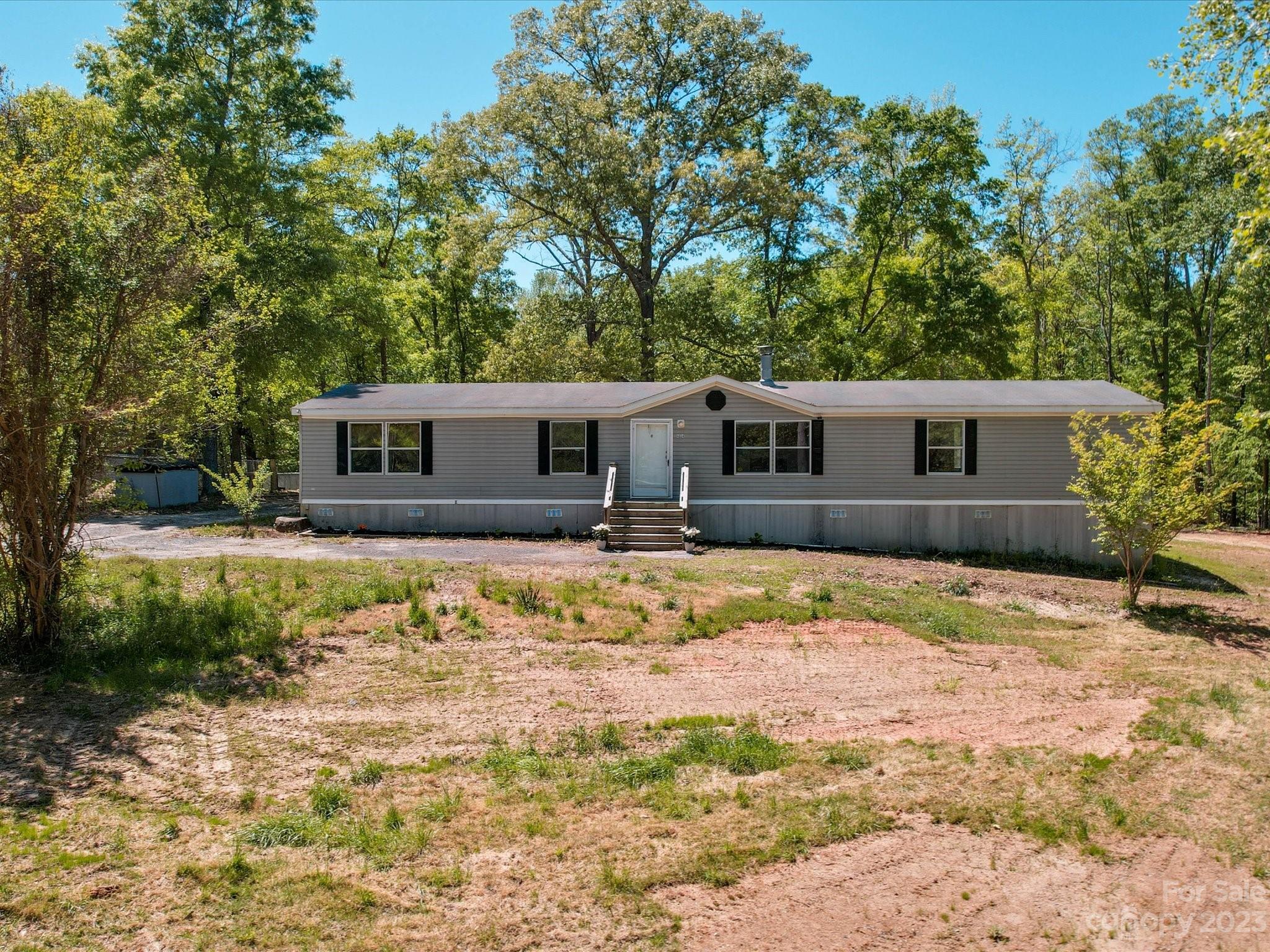 4034 Berry Hill Road Edgemoor, SC 29712 - Photo 1 of 31 a house with swimming pool in front of it