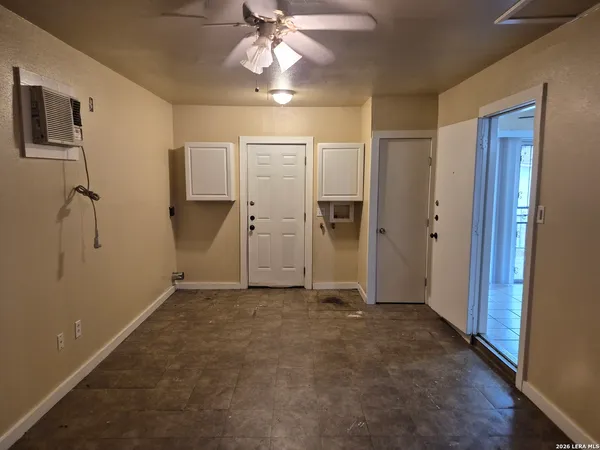 an empty room with closet area