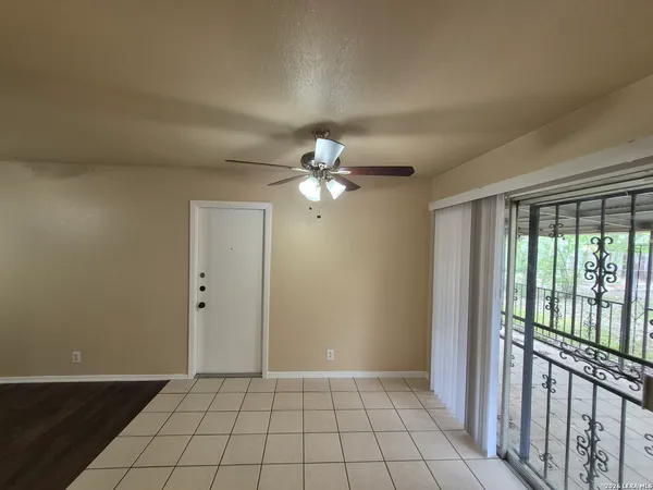 a kitchen with a sink a window and cabinets