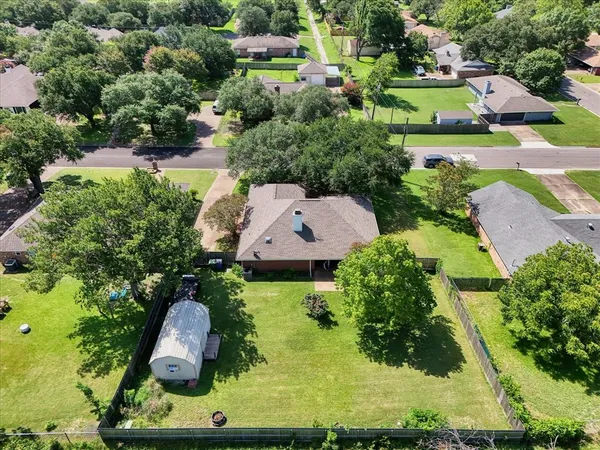 an aerial view of house with yard swimming pool and outdoor seating