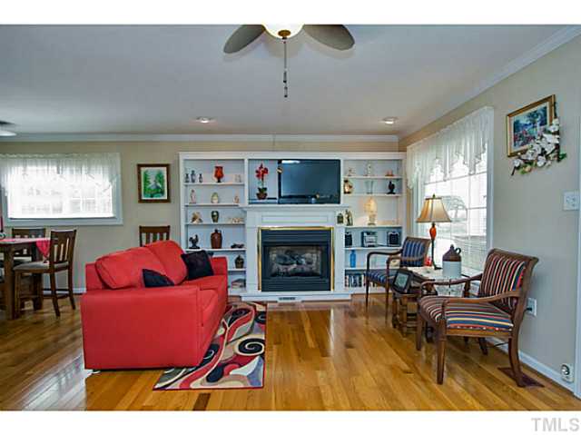 6637 Ten-Ten Road Apex, NC 27539 - Photo 4 of 25 The Family Room boasts a beautiful fireplace flanked by wonderful built in shelves. Gas logs are remote controlled!