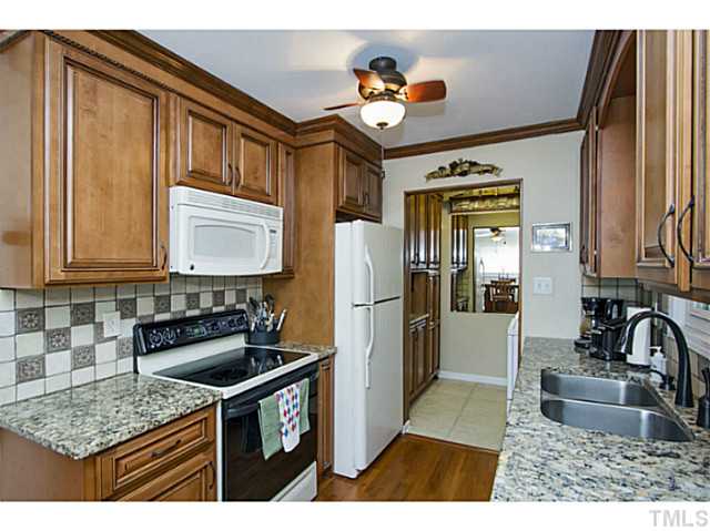 6637 Ten-Ten Road Apex, NC 27539 - Photo 6 of 25 Please look beyond the Kitchen in this photo and the next to see what an awesome Laundry Room it is! Custom Cabinetry on both walls, granite counter top and tile back splash as well!!!