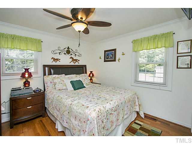 6637 Ten-Ten Road Apex, NC 27539 - Photo 10 of 25 Master Bedroom with beautiful views - bright and sunny with gorgeous hardwood flooring!