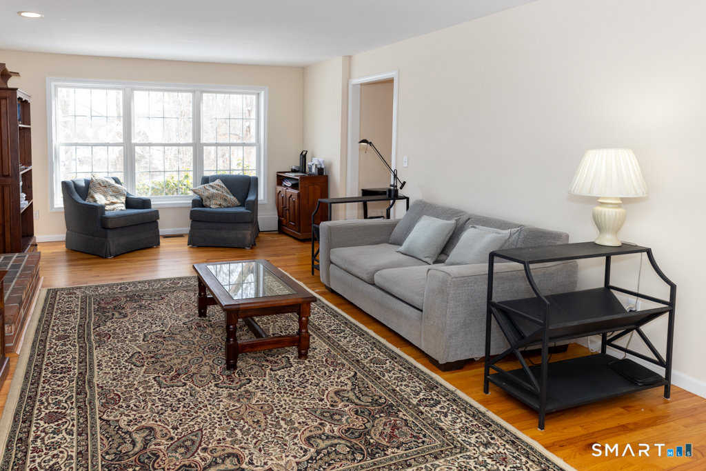 85 McVeagh Road Westbrook, CT 06498 - Photo 11 of 39 a living room with furniture and a rug