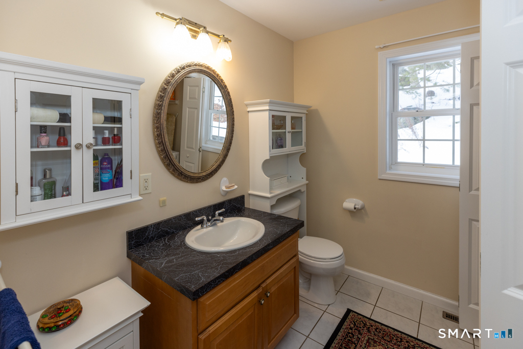 85 McVeagh Road Westbrook, CT 06498 - Photo 15 of 40 First floor Half bath with washer dryer