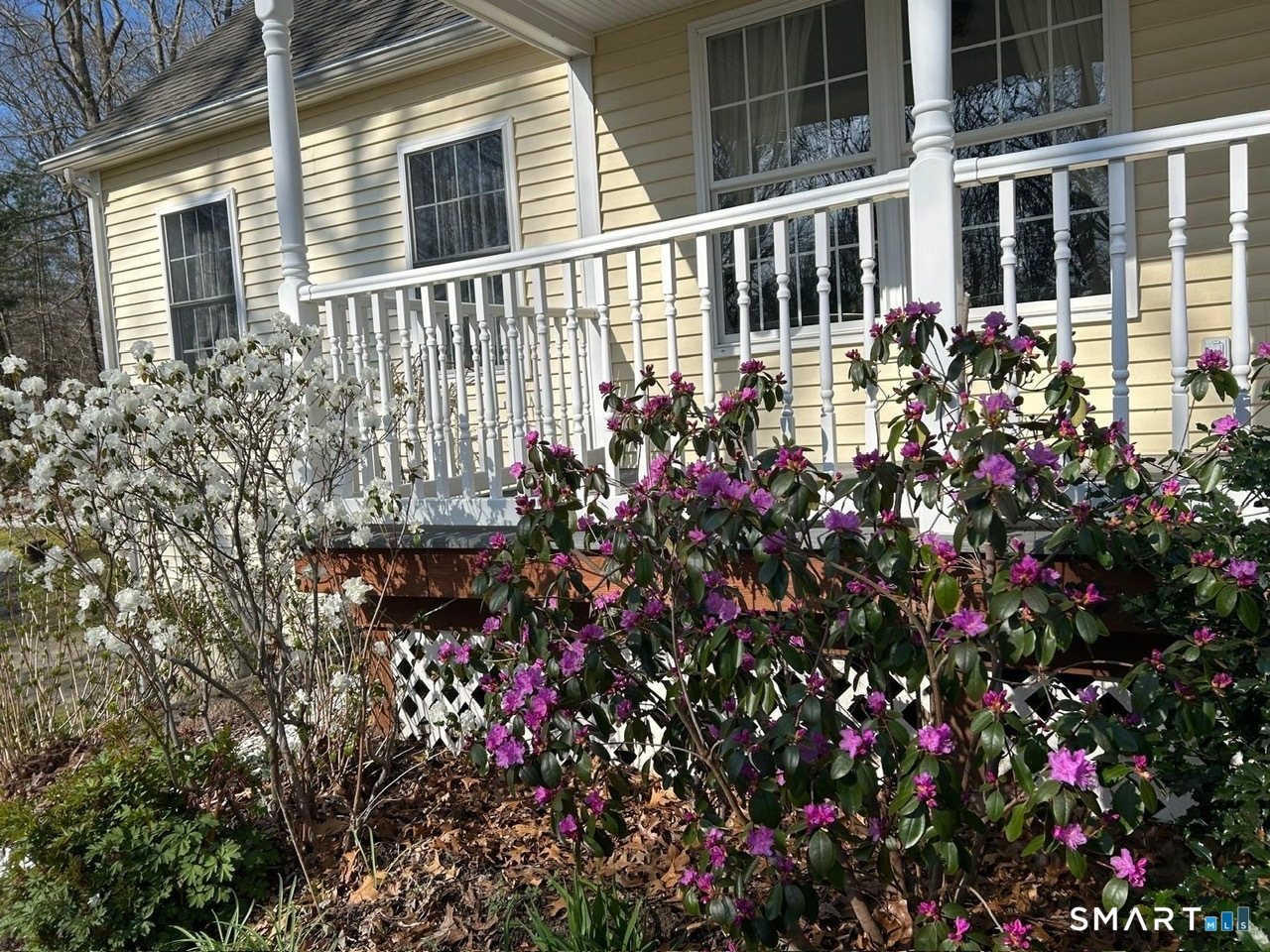85 McVeagh Road Westbrook, CT 06498 - Photo 2 of 39 a view of a house with a flower garden