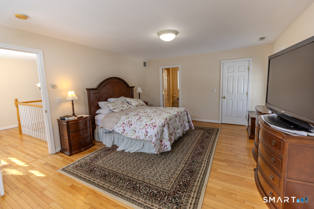 85 McVeagh Road Westbrook, CT 06498 - Photo 22 of 39 a living room with a couch and a flat screen tv