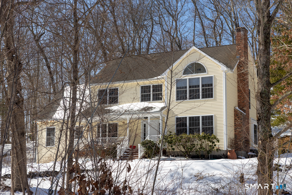 85 McVeagh Road Westbrook, CT 06498 - Photo 3 of 39 a front view of a house with a yard