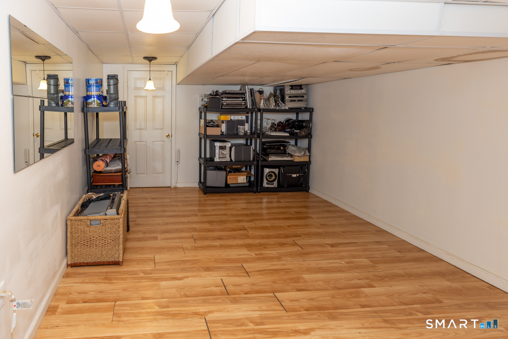 85 McVeagh Road Westbrook, CT 06498 - Photo 33 of 39 a view of walk in closet with clothes and shoes