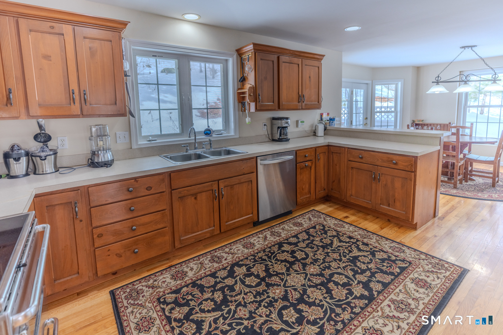 85 McVeagh Road Westbrook, CT 06498 - Photo 5 of 39 a kitchen with stainless steel appliances granite countertop a sink dishwasher stove and cabinets