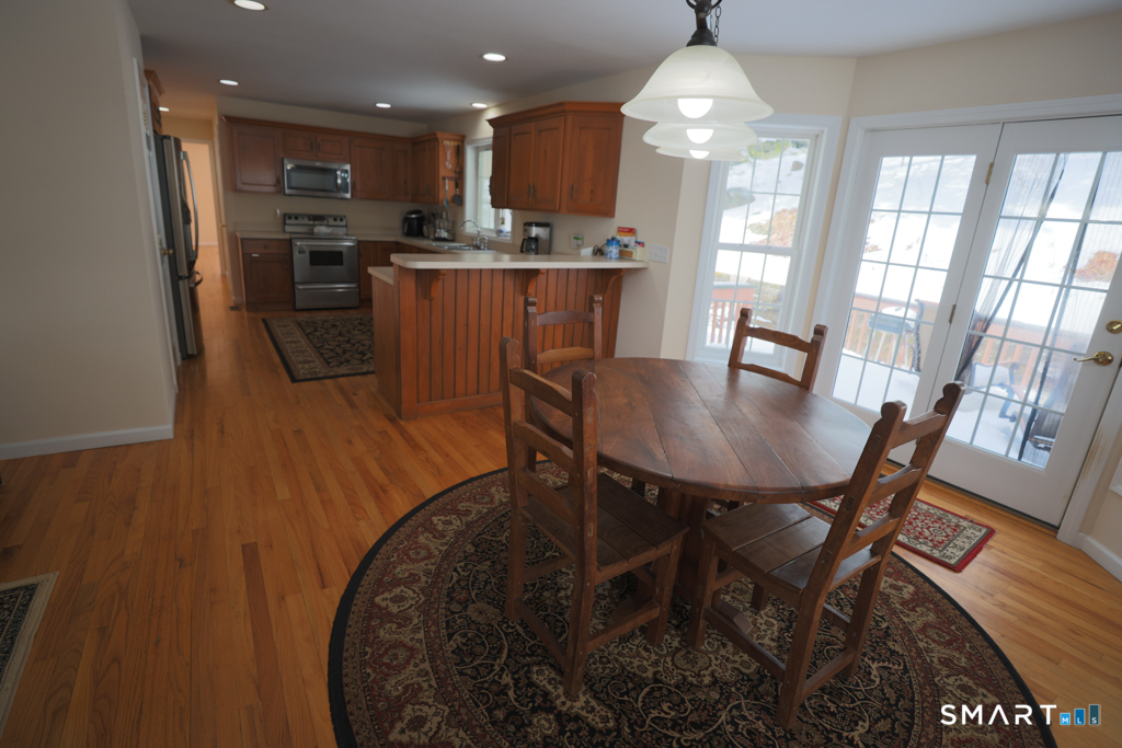 85 McVeagh Road Westbrook, CT 06498 - Photo 39 of 39 a dining room with furniture a chandelier and wooden floor