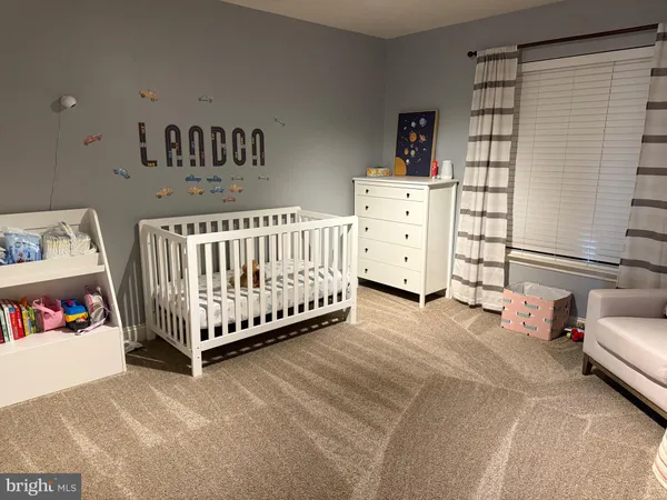 a view of a livingroom with furniture and toys