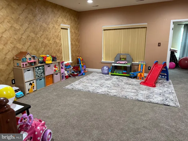 a kids room with toys and a couch