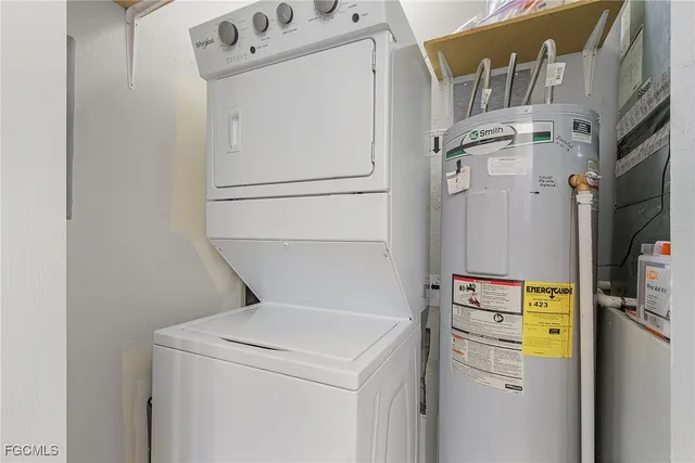 a view of a city from a dining room with a table and chairs