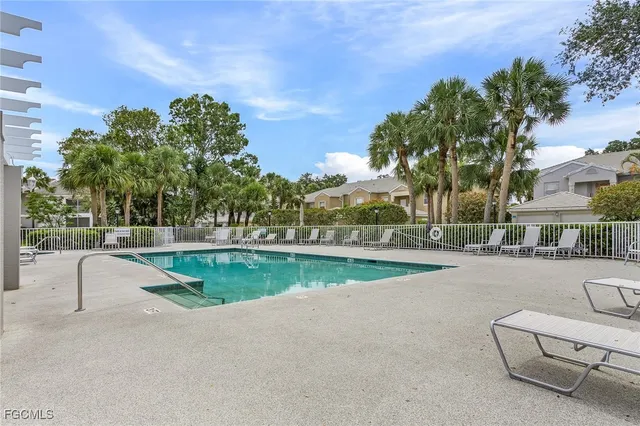a view of a swimming pool with a patio