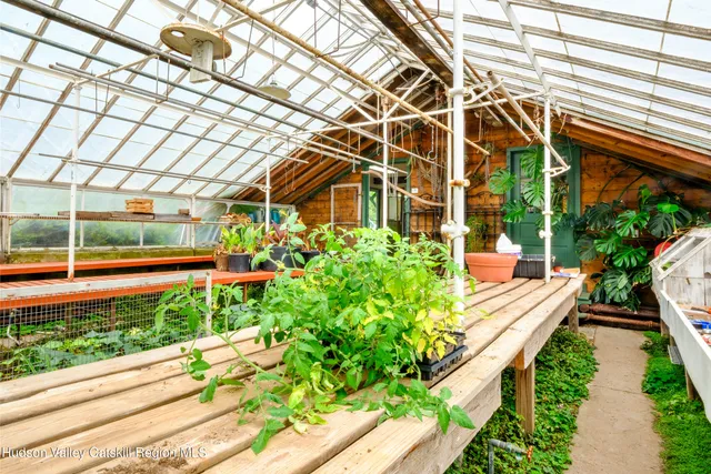 a view of balcony with floor to ceiling windows and wooden floor