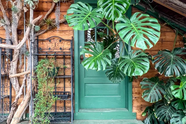 a wooden bench sitting in front of a building