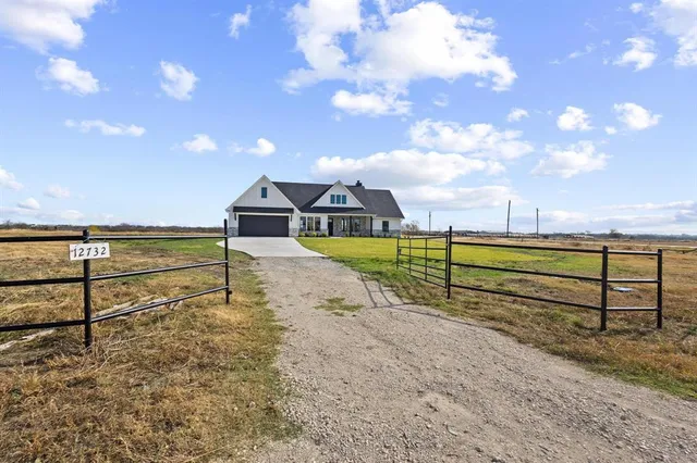 an aerial view of a house with a ocean view