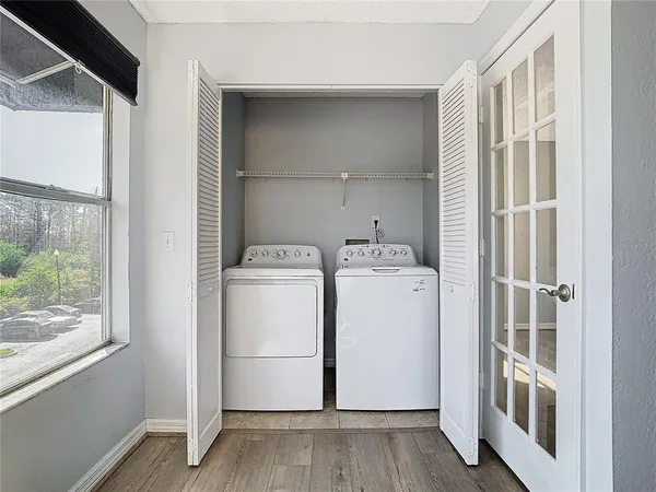a view of storage and utility room with washer and dryer