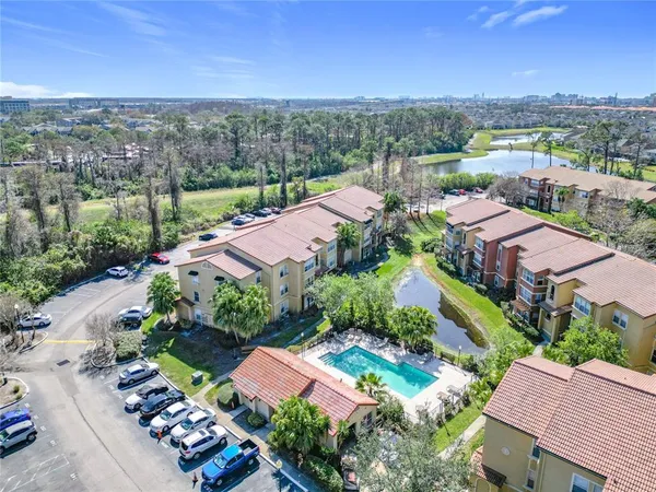 an aerial view of house with yard