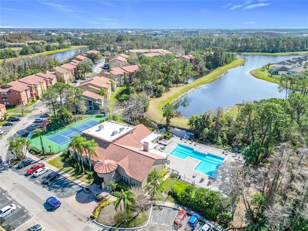 an aerial view of residential houses and outdoor space