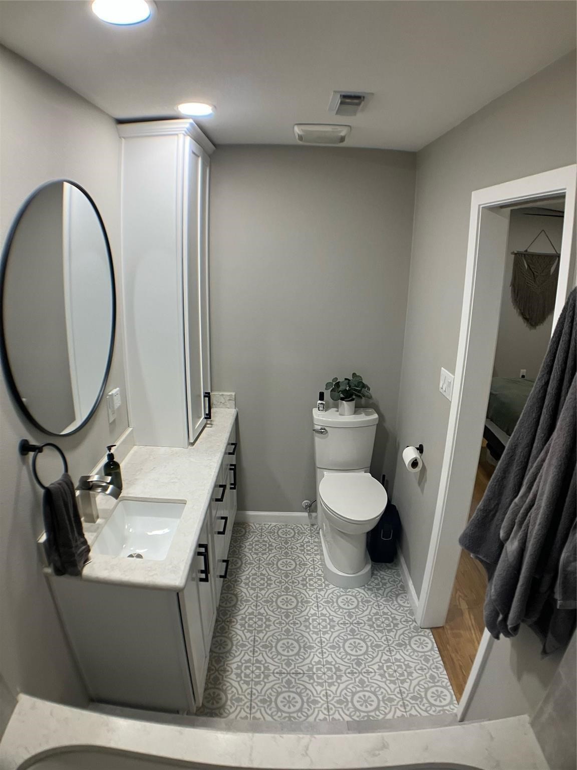 3027 Guese Road Houston, TX 77018 - Photo 10 of 22 Contemporary bathroom vanity area features updated lighting, modern fixtures, and ample counter space.