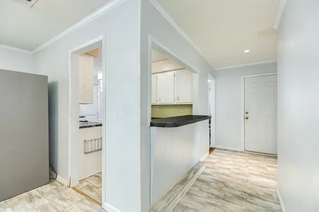 a view of a kitchen from the hallway