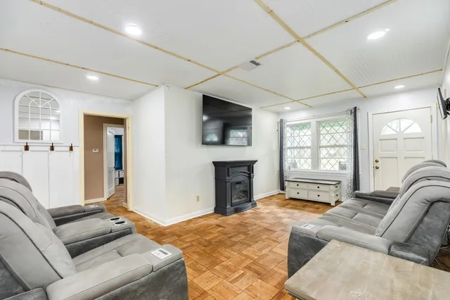a bedroom with furniture and a fireplace
