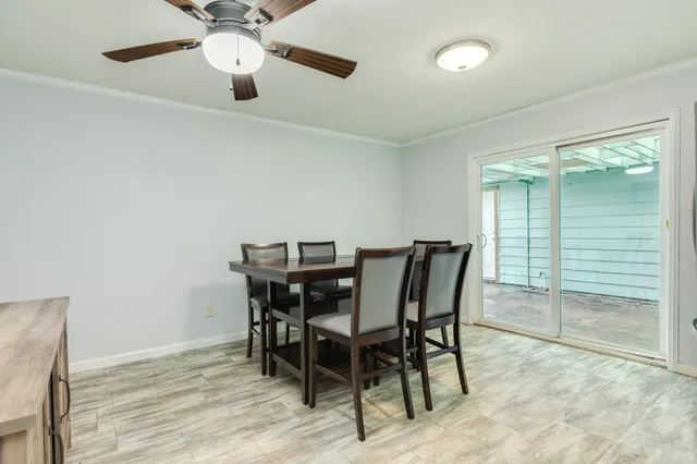 a dining room with furniture and window