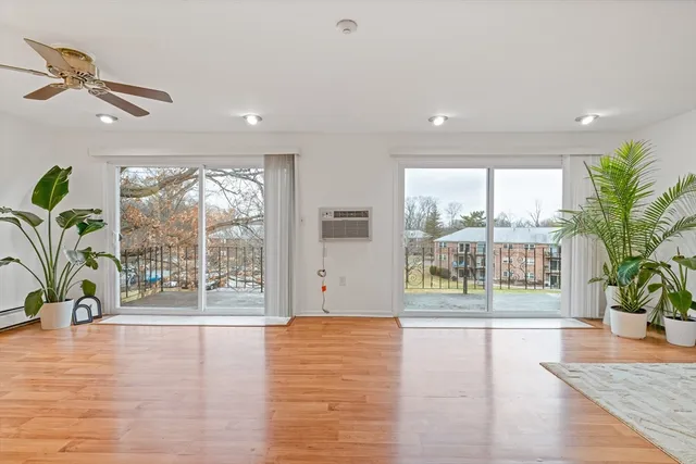 a view of an entryway with wooden floor
