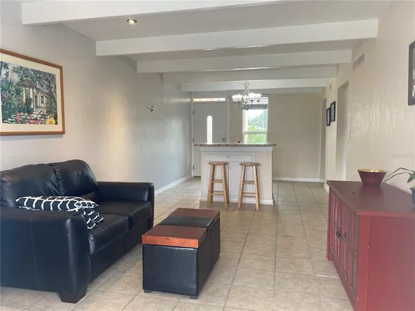 a kitchen with stainless steel appliances granite countertop a sink a refrigerator and a stove