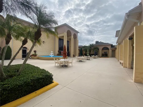 a view of a swimming pool with a patio