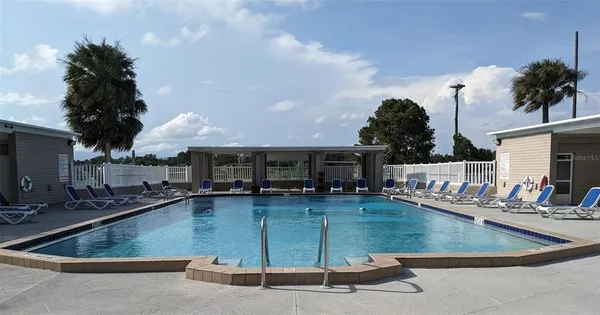 a view of a house with swimming pool