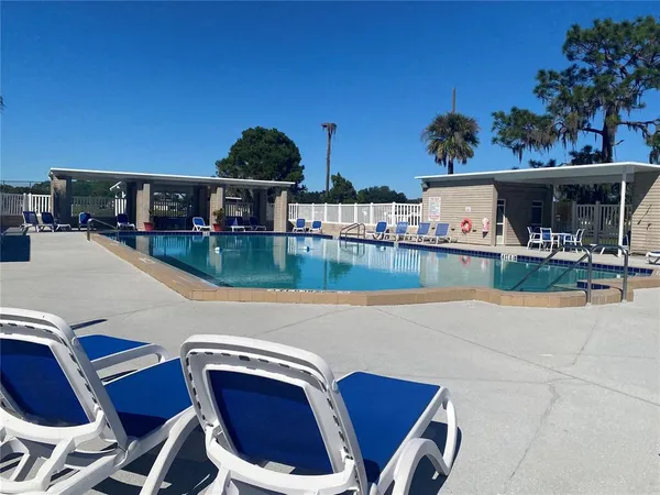 a view of a swimming pool with a patio